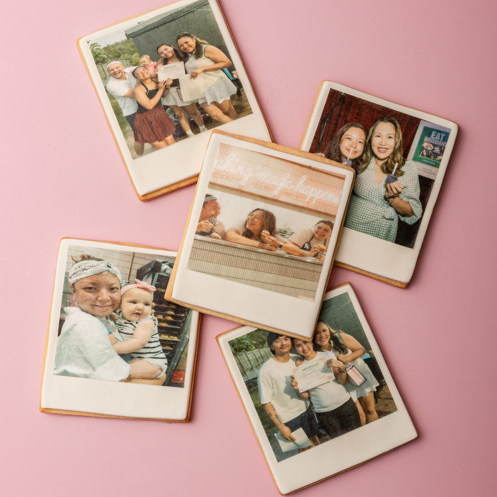 Collection of Polaroid-style cookies with family photos on a pink background