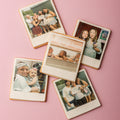 Collection of Polaroid-style cookies with family photos on a pink background