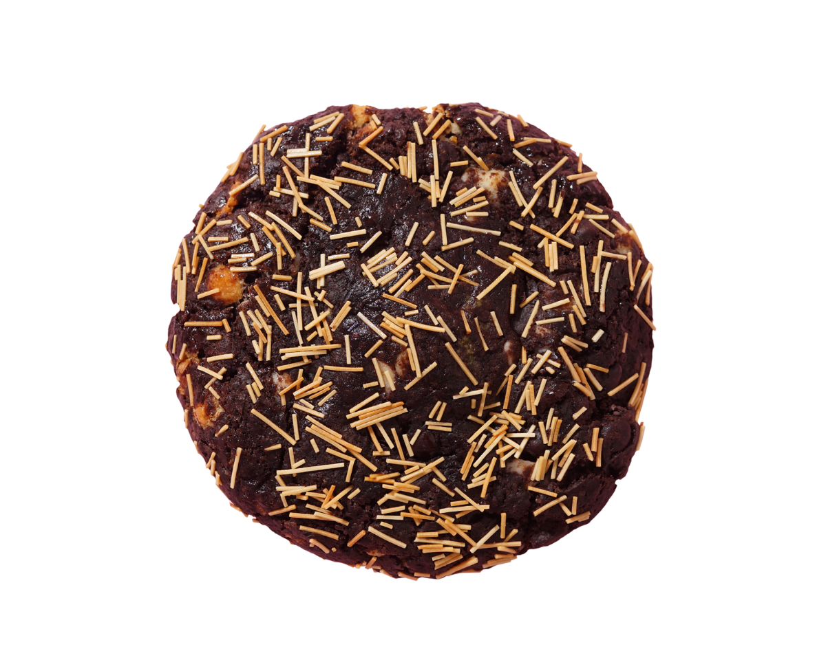 Chocolate cookie with gold sprinkles on a white background